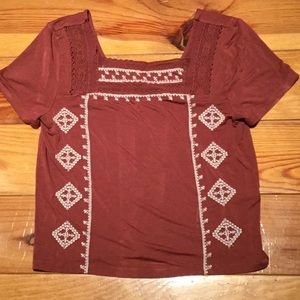 American Eagle surface shirt. Embroidered in  the front.